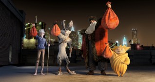 (Left to right)  Jack Frost (Chris Pine), Bunnymund (Hugh Jackman), North (Alec Baldwin) and Sandman show off their holiday loot in DreamWorks Animation’s RISE OF THE GUARDIANS to be released by Paramount Pictures.
RG-049